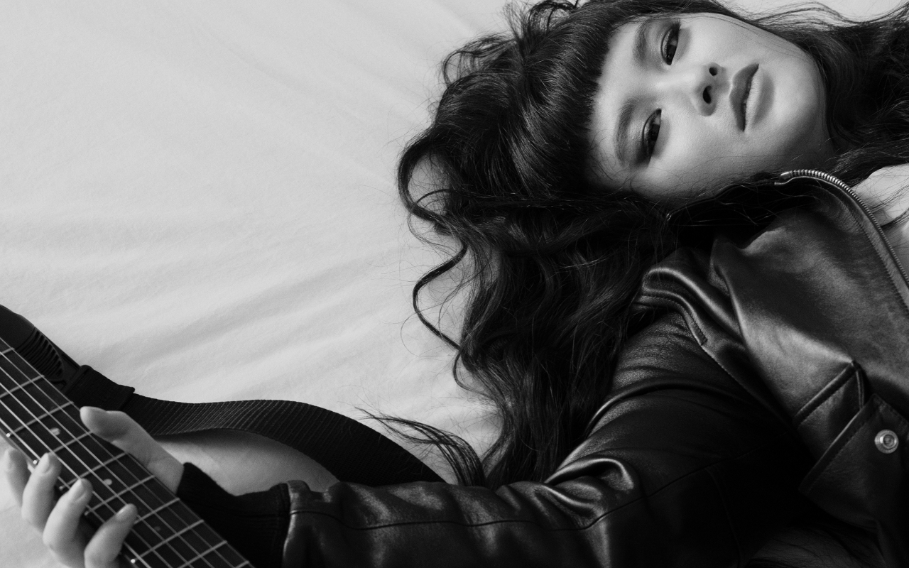 Asia Chow with guitar. Photo by Mert Alas.